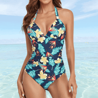 Maillot de bain une pièce tropical avec fleurs jaunes sur fond bleu, amincissant et chic, parfait pour la plage.